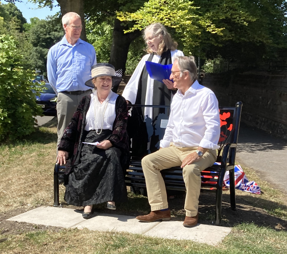 Paul Newman Sue Rodd Vanessa Butler and James Sheppard on the new Centenary Bench.  Vanessa is in character as Lady Currie of Upper Upham House